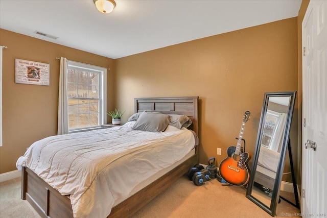 bedroom featuring carpet flooring, baseboards, and visible vents