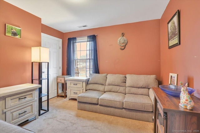 living room with visible vents and light carpet