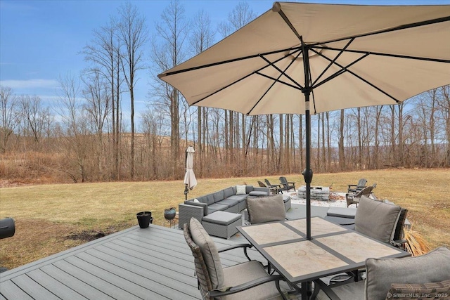 view of patio / terrace with a wooden deck, outdoor dining space, and outdoor lounge area