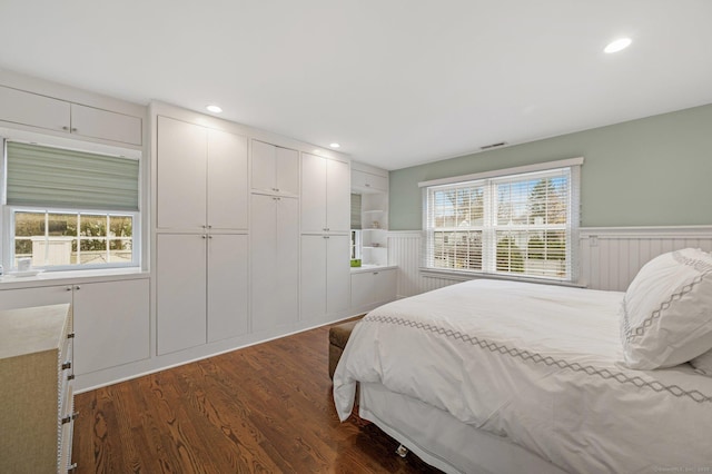 24 Laforge Rd, Darien, CT 06820 - bedroom with wainscoting, dark wood-type flooring, multiple windows, a closet, and recessed lighting