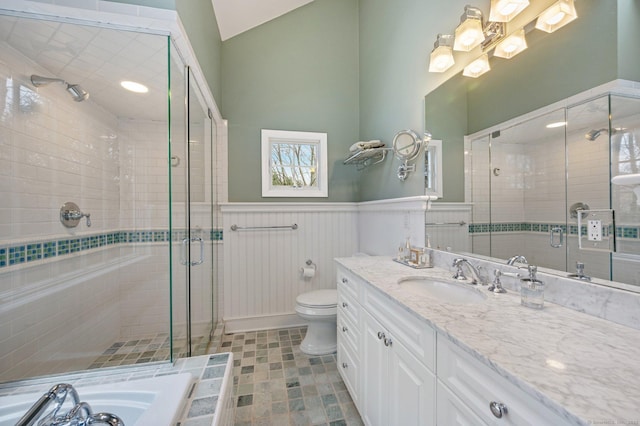 24 Laforge Rd, Darien, CT 06820 - bathroom featuring wainscoting, a stall shower, vanity, lofted ceiling, and a bath