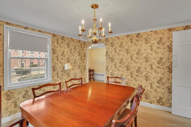 carpeted dining room featuring wallpapered walls, radiator heating unit, baseboards, and arched walkways