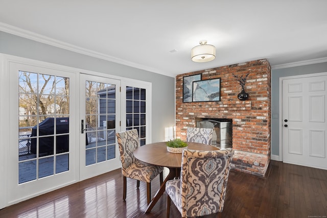 dining space featuring ornamental molding, hardwood / wood-style floors, and french doors