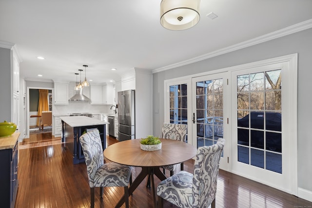 dining space with baseboards, dark wood-type flooring, crown molding, french doors, and recessed lighting