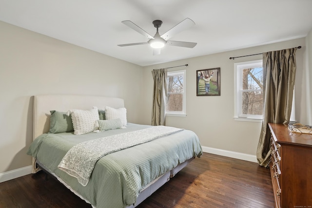 bedroom featuring a ceiling fan, baseboards, and wood finished floors