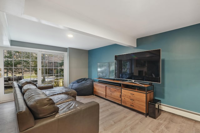 living room featuring light wood-style floors, a baseboard radiator, and beamed ceiling