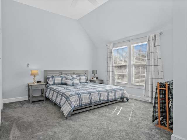 bedroom with vaulted ceiling, carpet, and baseboards