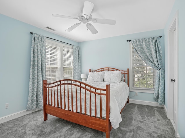 bedroom featuring visible vents, baseboards, ceiling fan, and carpet flooring