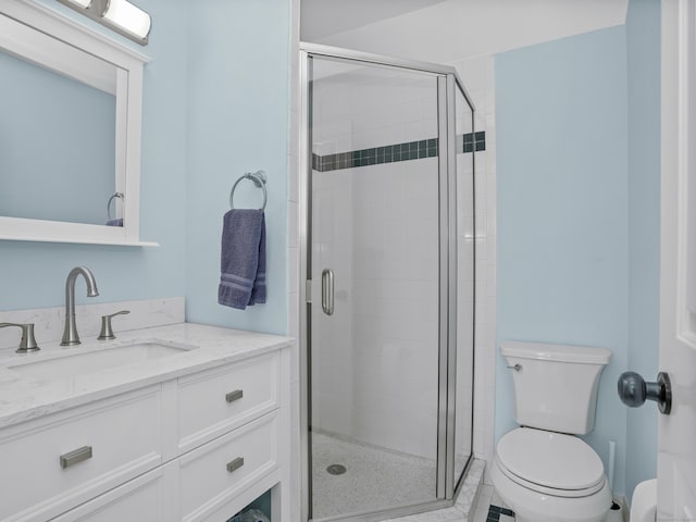 full bathroom with vanity, toilet, and a stall shower