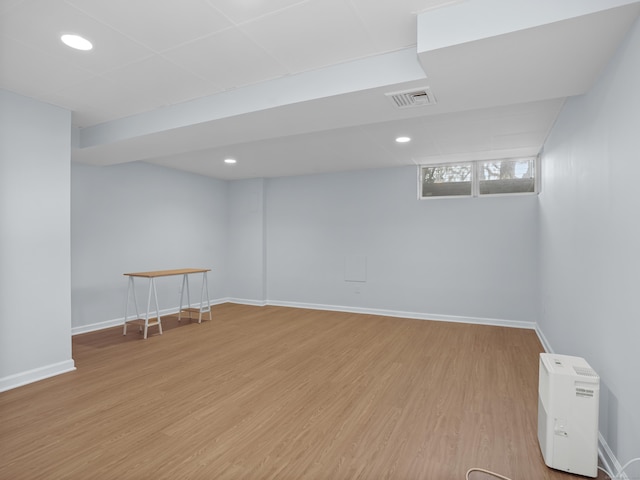 basement featuring recessed lighting, visible vents, baseboards, and light wood finished floors