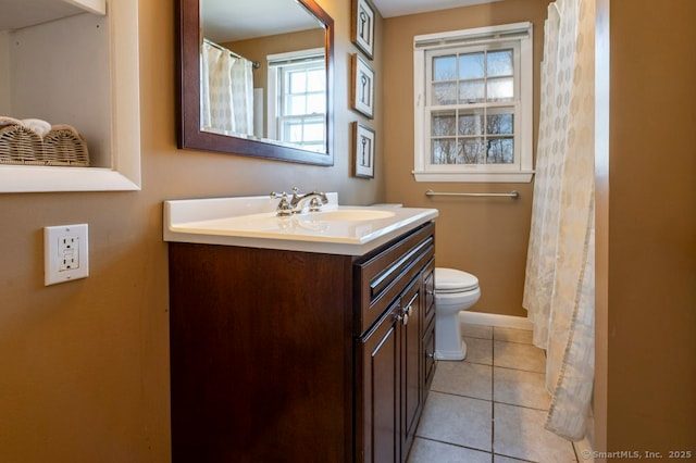 full bath featuring tile patterned flooring, toilet, vanity, and baseboards