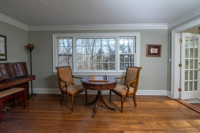 dining space with dark wood-style floors, baseboards, and ornamental molding