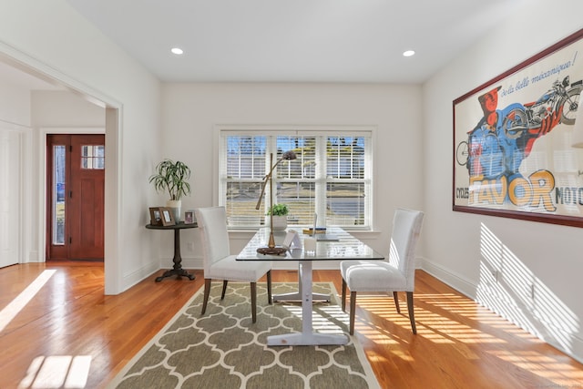 dining room featuring recessed lighting, baseboards, and wood finished floors