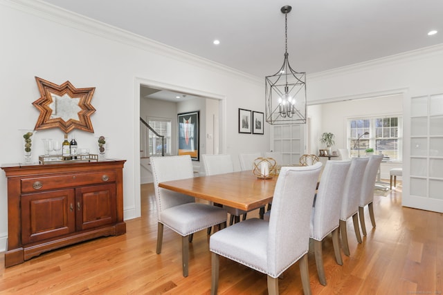 dining space with recessed lighting, light wood finished floors, and ornamental molding