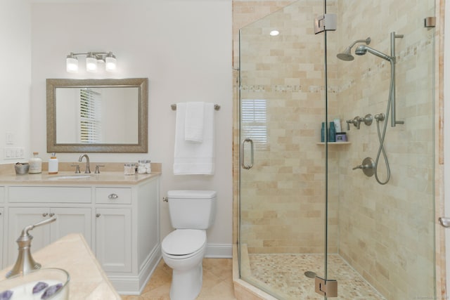 full bathroom featuring tile patterned floors, toilet, a stall shower, and vanity