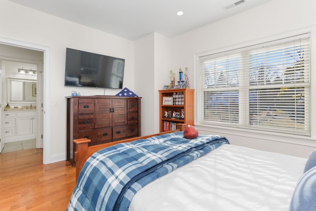 bedroom featuring visible vents, recessed lighting, baseboards, and wood finished floors