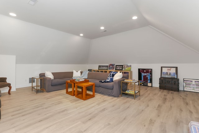 living room featuring visible vents, recessed lighting, lofted ceiling, and wood finished floors