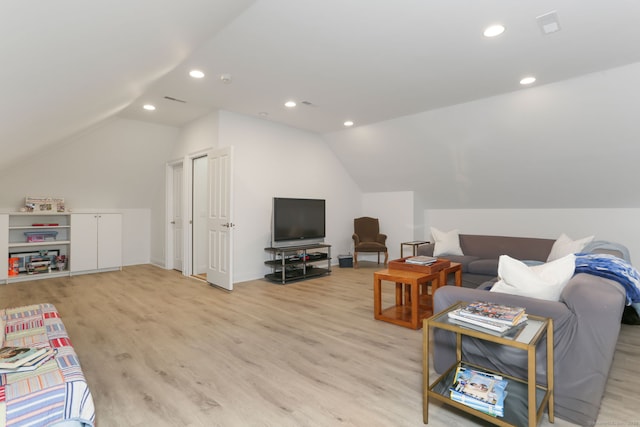 living area featuring light wood finished floors, recessed lighting, and lofted ceiling