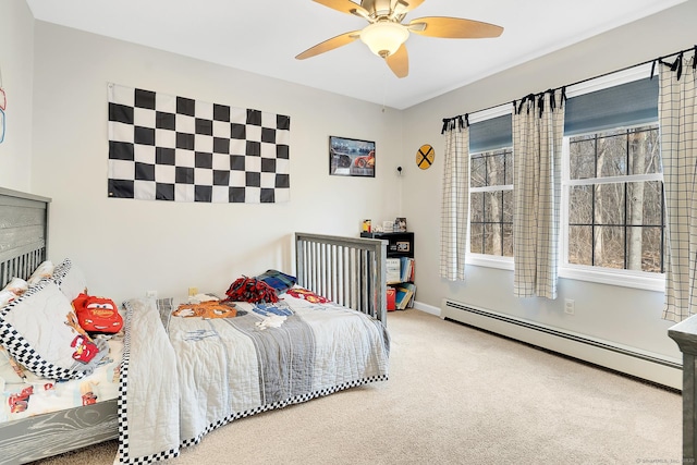 carpeted bedroom with baseboards, baseboard heating, and ceiling fan