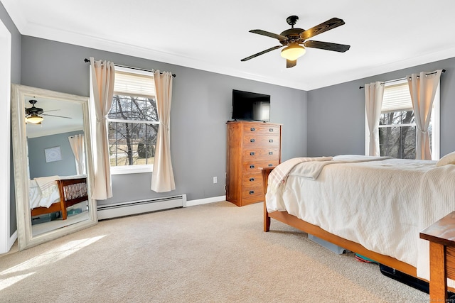 carpeted bedroom featuring crown molding, a ceiling fan, baseboards, and a baseboard radiator