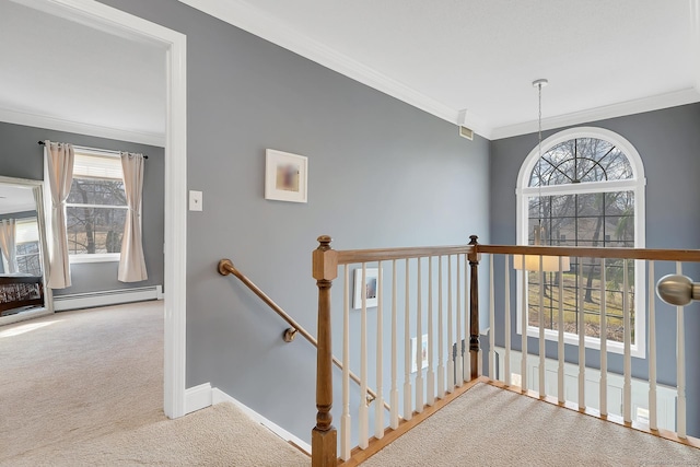 hall featuring baseboards, a baseboard radiator, ornamental molding, carpet flooring, and an upstairs landing