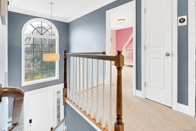 stairway with crown molding, carpet flooring, and baseboards