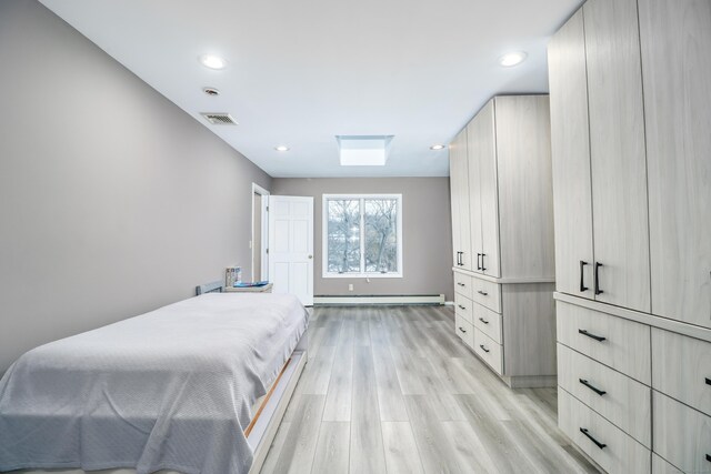 38 N Lake Shore Dr, Brookfield, CT 06804 - bedroom with light wood-style flooring, a baseboard heating unit, and recessed lighting