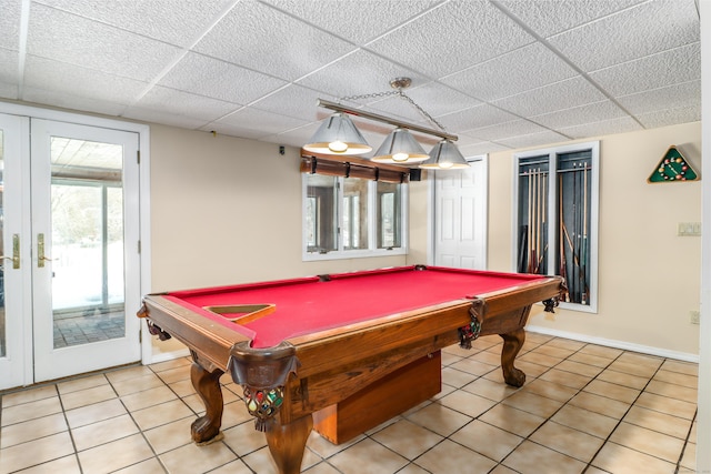 recreation room with light tile patterned flooring, a drop ceiling, pool table, and baseboards