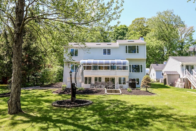 38 N Lake Shore Dr, Brookfield, CT 06804 - rear view of house with a sunroom, a chimney, and a yard