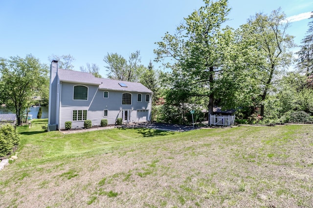 38 N Lake Shore Dr, Brookfield, CT 06804 - rear view of house featuring a chimney and a yard
