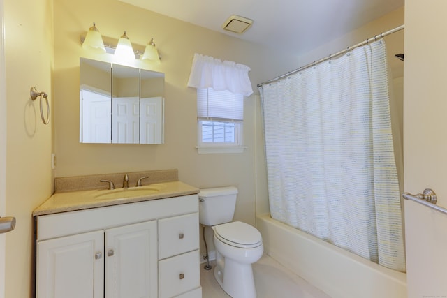 full bath with vanity, toilet, and shower / bath combo