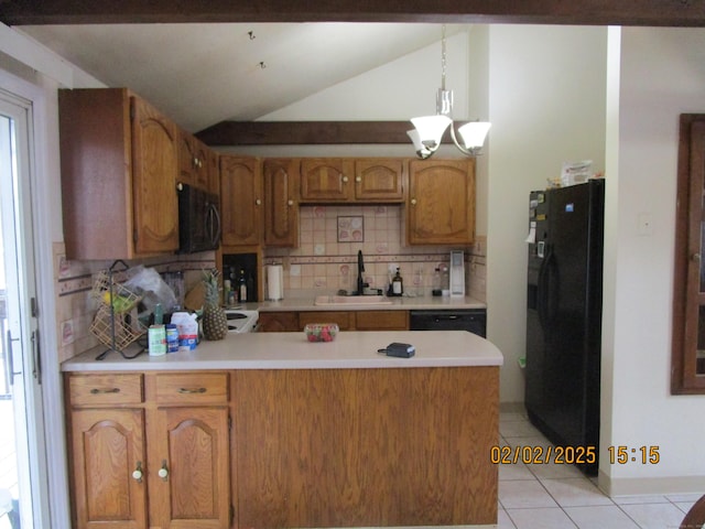 kitchen featuring light countertops, a peninsula, light tile patterned flooring, black appliances, and a sink