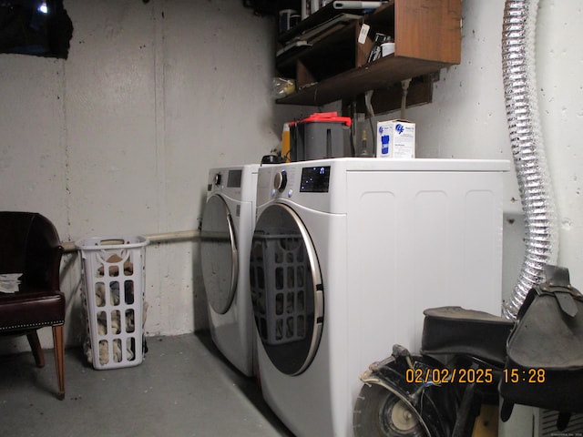 clothes washing area with laundry area and washing machine and clothes dryer