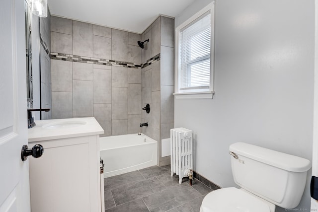 full bath with tub / shower combination, radiator, baseboards, toilet, and vanity