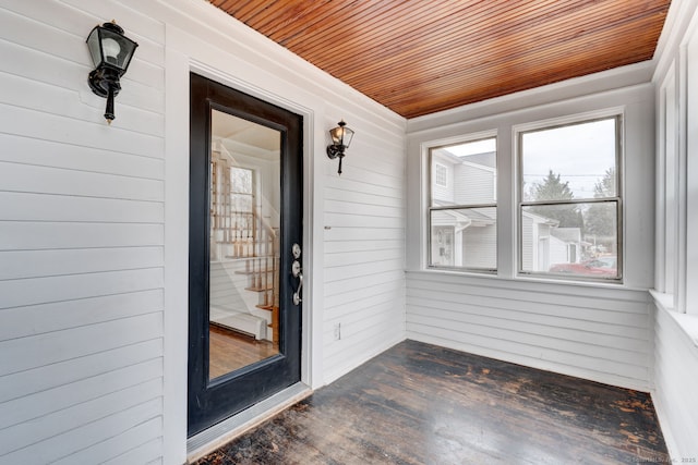 unfurnished sunroom with wooden ceiling