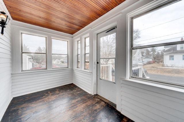 unfurnished sunroom with wooden ceiling