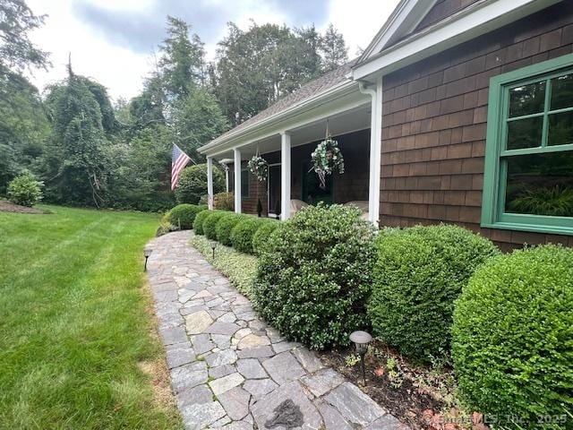 view of property exterior with a lawn