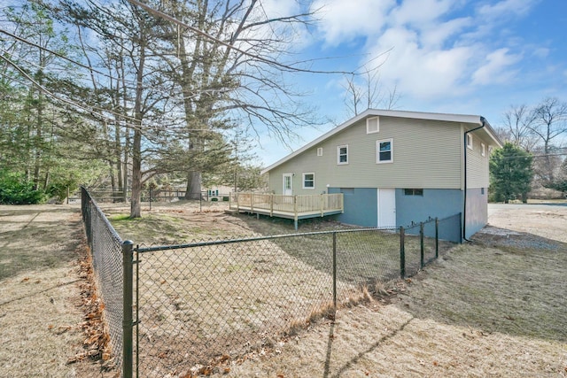 exterior space featuring a wooden deck and fence