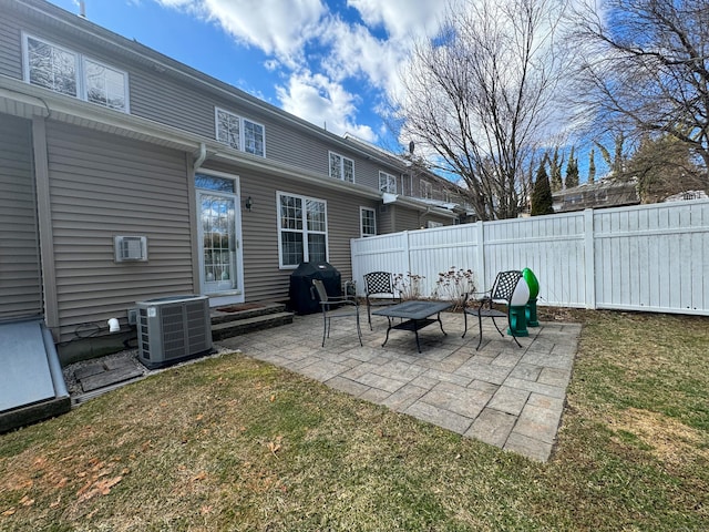 view of patio / terrace featuring central AC, area for grilling, and fence