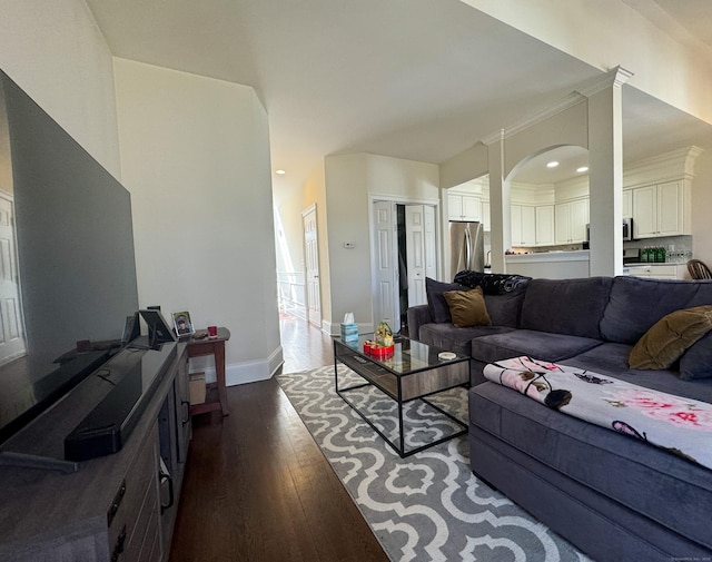 living room featuring dark wood-style floors, baseboards, and recessed lighting