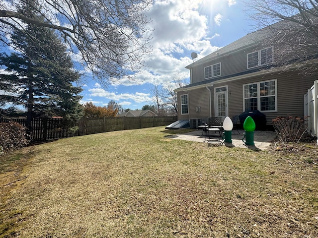 view of yard with a patio and a fenced backyard