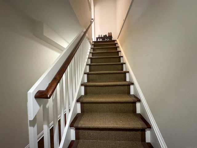 stairway with baseboards