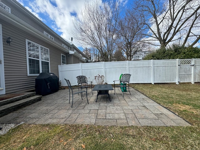 view of patio / terrace featuring area for grilling and fence