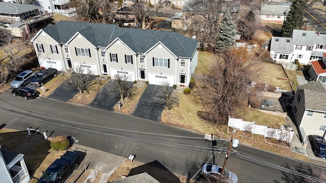 birds eye view of property with a residential view