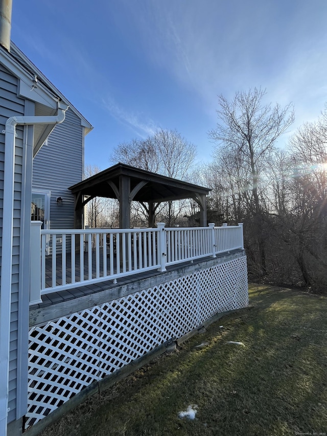 wooden deck with a lawn