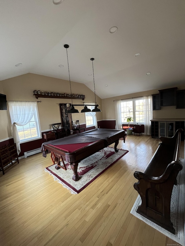 recreation room featuring pool table, a wealth of natural light, wood-type flooring, and baseboard heating