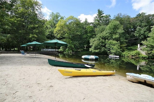 surrounding community with a water view