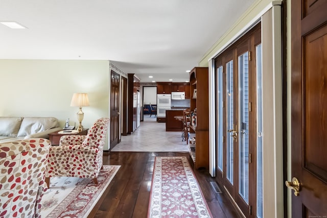 entryway with recessed lighting and dark wood-type flooring