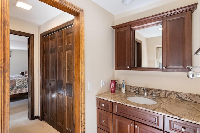 ensuite bathroom featuring vanity and ensuite bath