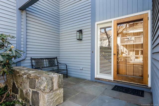 property entrance with a patio area